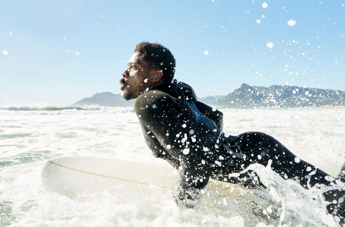 a surfer about to catch a wave