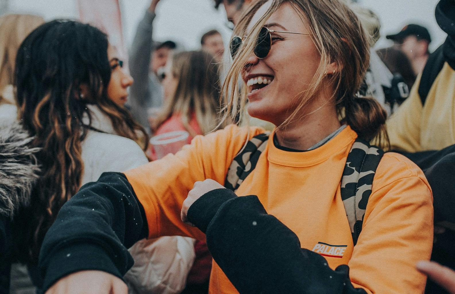 a girl smiling at a festival