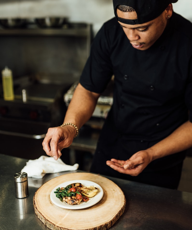 A chef prepares a plate