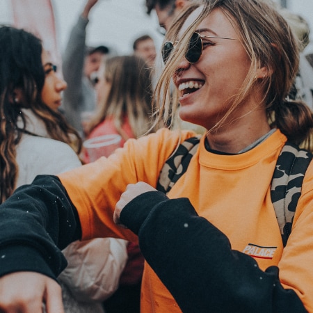 A girl smiling at a festival