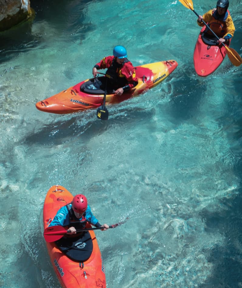 Kayakers on an azure river